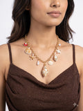 Seashell charm statement necklace worn by model