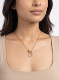 Cat charm pearl pendant necklace worn by model